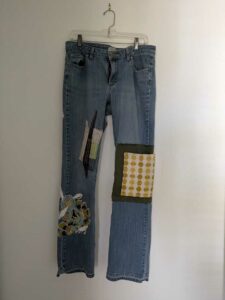 image of upcycled, thrifted jeans, worked with deadstock and reclaimed fabrics and embellishments