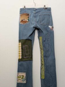 image of upcycled, thrifted jeans, worked with deadstock and reclaimed fabrics and embellishments