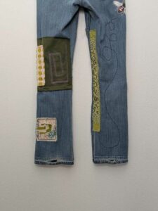 image of upcycled, thrifted jeans, worked with deadstock and reclaimed fabrics and embellishments