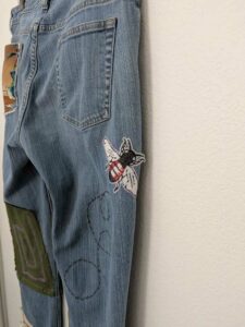 image of upcycled, thrifted jeans, worked with deadstock and reclaimed fabrics and embellishments