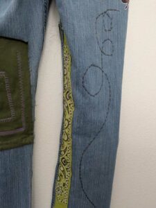 image of upcycled, thrifted jeans, worked with deadstock and reclaimed fabrics and embellishments