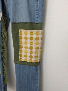 image of upcycled, thrifted jeans, worked with deadstock and reclaimed fabrics and embellishments