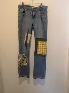image of upcycled, thrifted jeans, worked with deadstock and reclaimed fabrics and embellishments