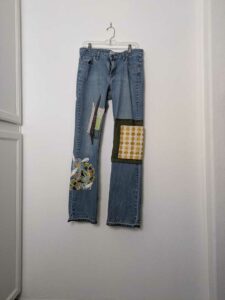 image of upcycled, thrifted jeans, worked with deadstock and reclaimed fabrics and embellishments