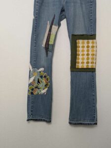 image of upcycled, thrifted jeans, worked with deadstock and reclaimed fabrics and embellishments