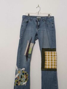 image of upcycled, thrifted jeans, worked with deadstock and reclaimed fabrics and embellishments