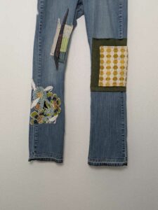 image of upcycled, thrifted jeans, worked with deadstock and reclaimed fabrics and embellishments