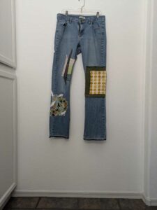 image of upcycled, thrifted jeans, worked with deadstock and reclaimed fabrics and embellishments